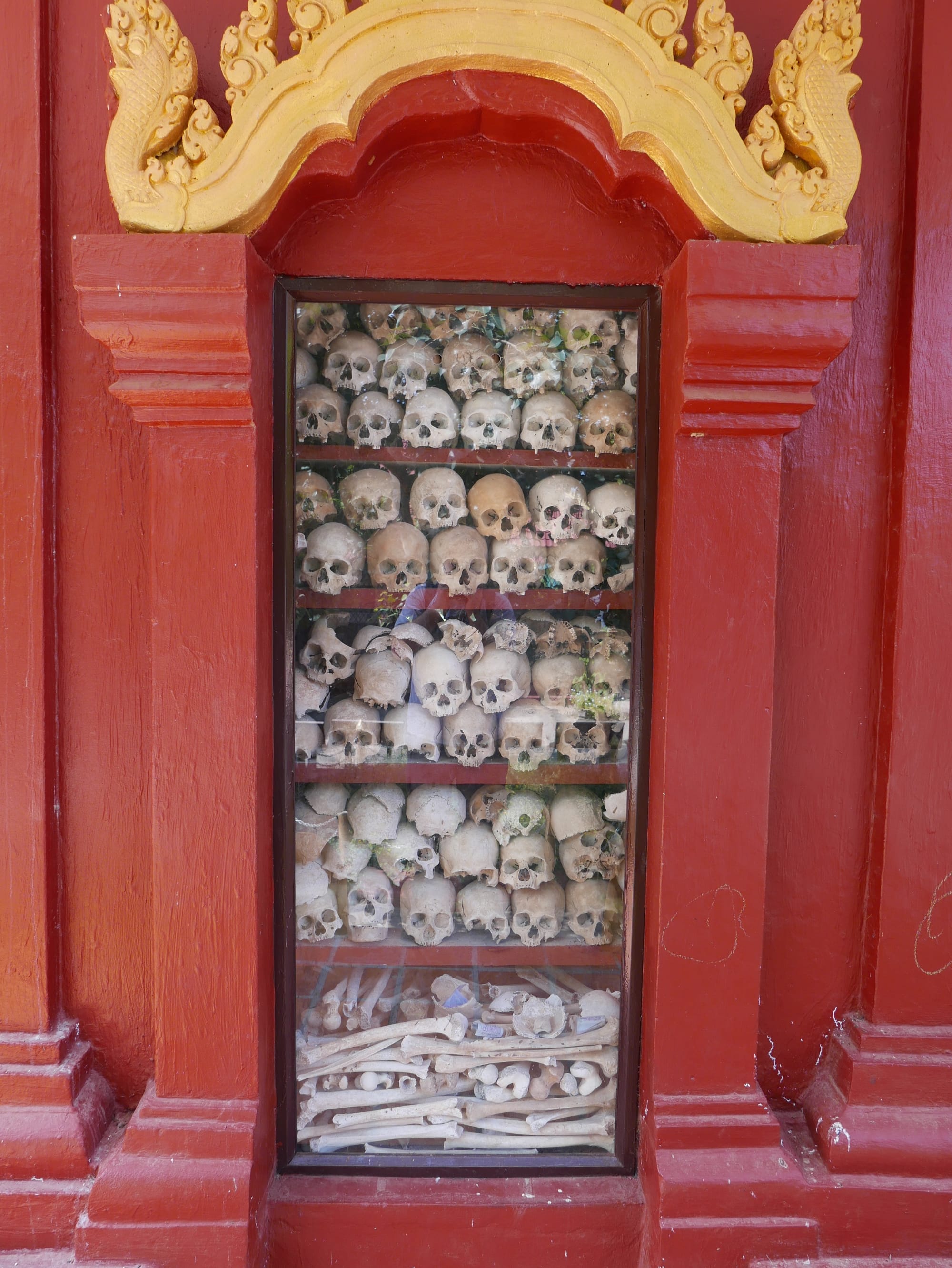 Photo by Author — human skulls at the Wat Thmey Killing Field Memorial, Siem Reap, Cambodia