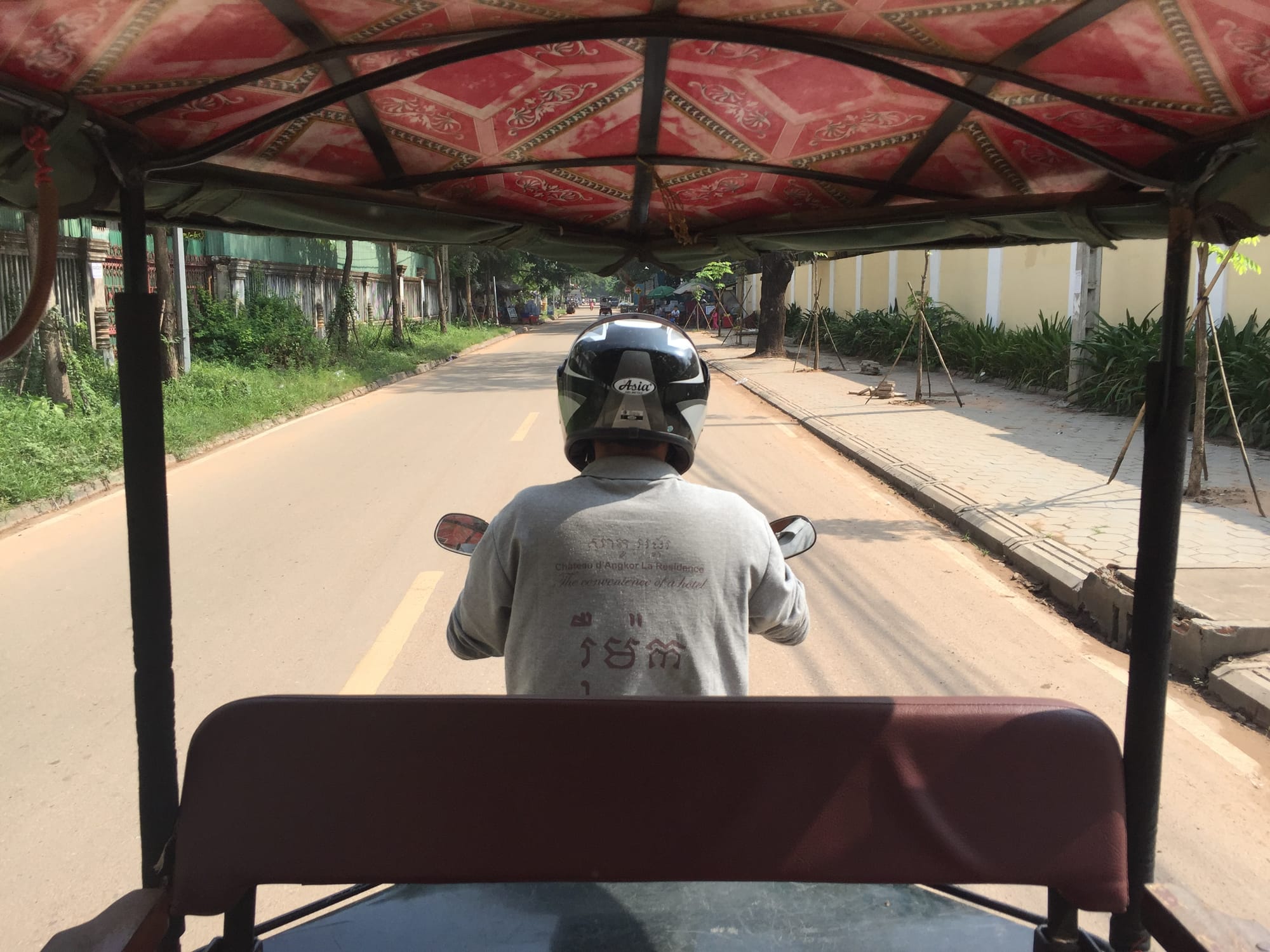 Photo by Author — my view from a Tuk Tuk on a sunny day — Tuk Tuks of Siem Reap, Cambodia