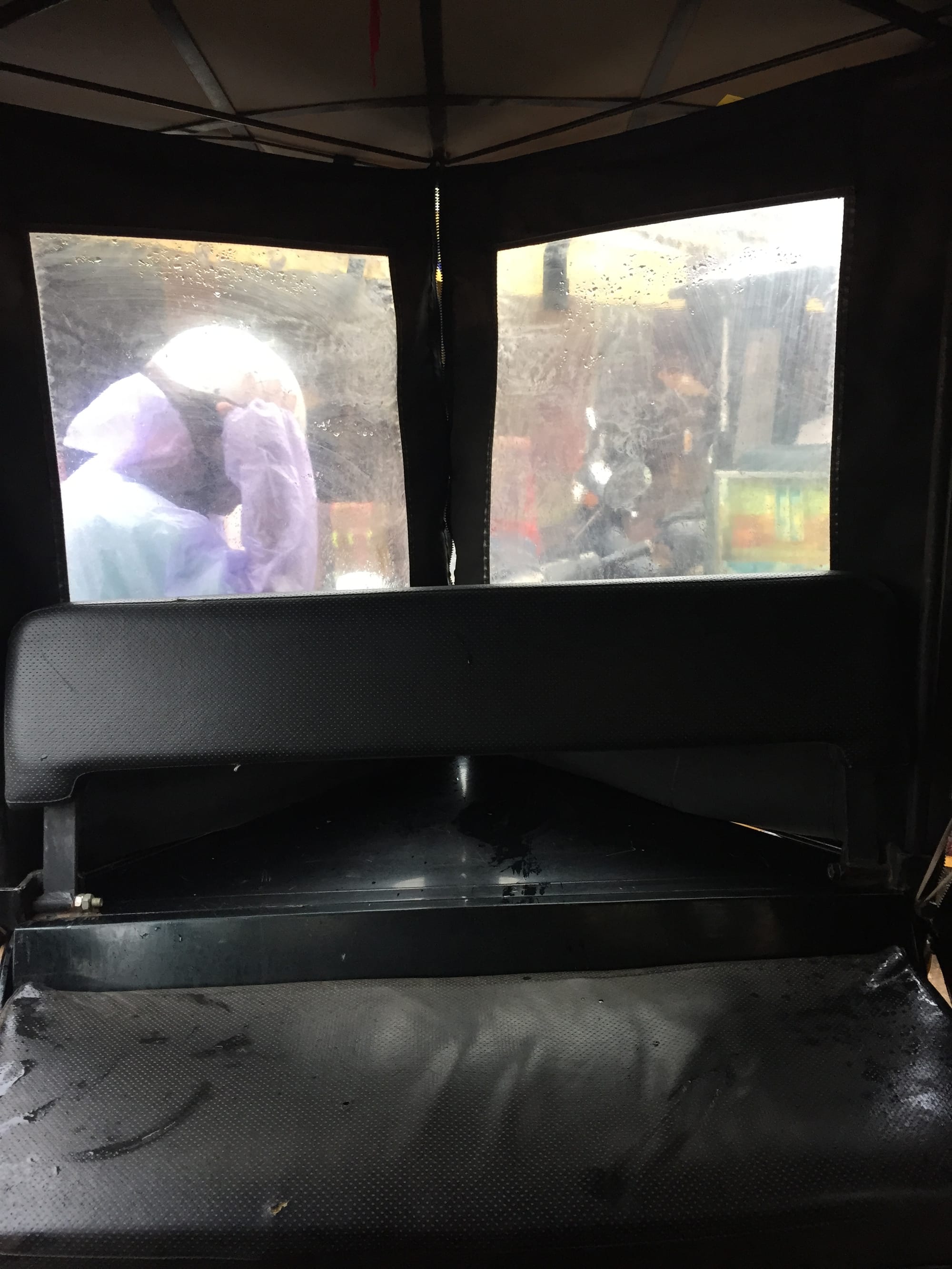 Photo by Author — the view from a Tuk Tuk on a rainy day — Tuk Tuks of Siem Reap, Cambodia