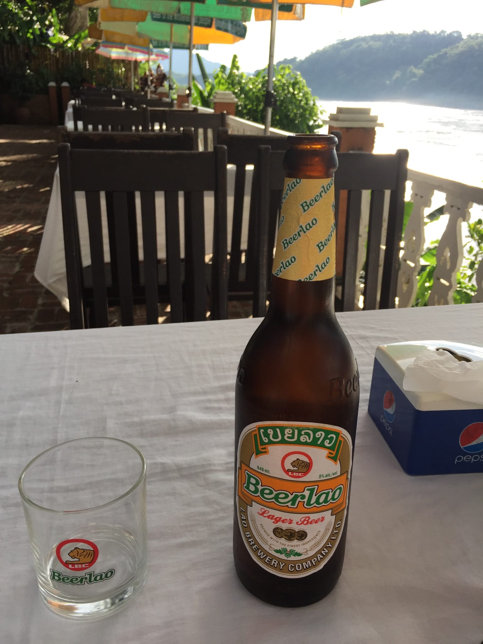 Photo by Author — a beer by the Mekong River — Luang Prabang (ຫລວງພະບາງ/ຫຼວງພະບາງ), Laos