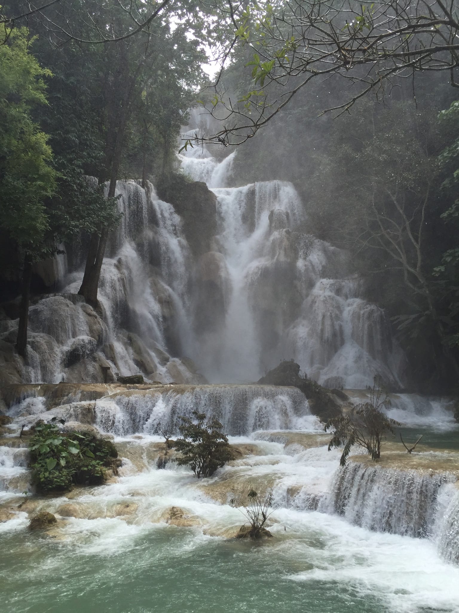 Photo by Author — a large waterfall at Kuang Si Waterfall (ນ້ຳຕົກຕາດ ກວາງຊີ), Laos — the lower pools