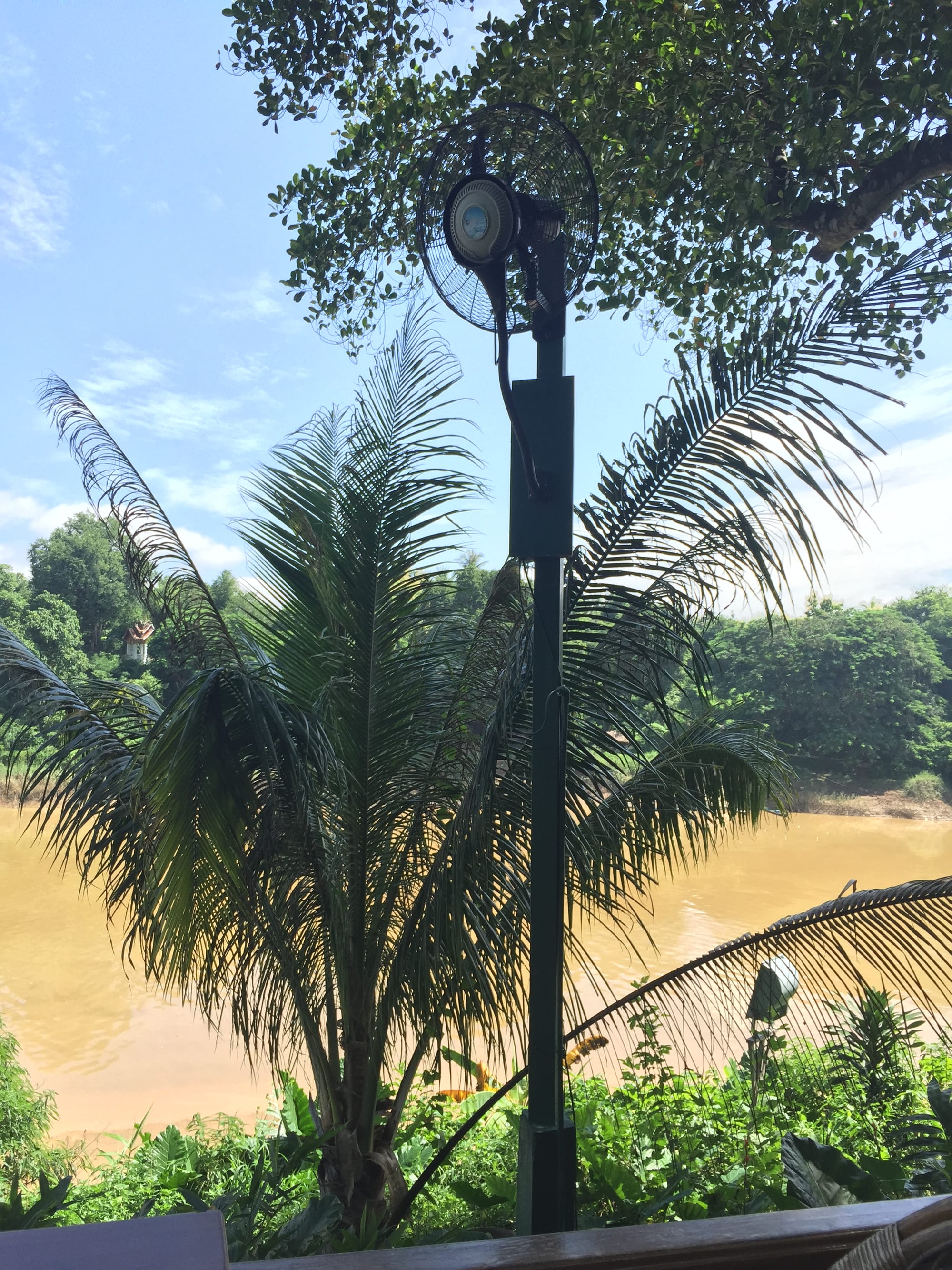 Photo by Author — morning coffee by the Mekong River at Viewpoint Café, Luang Prabang (ຫລວງພະບາງ/ຫຼວງພະບາງ), Laos — preparing for take-off — the loudest fans I have ever heard