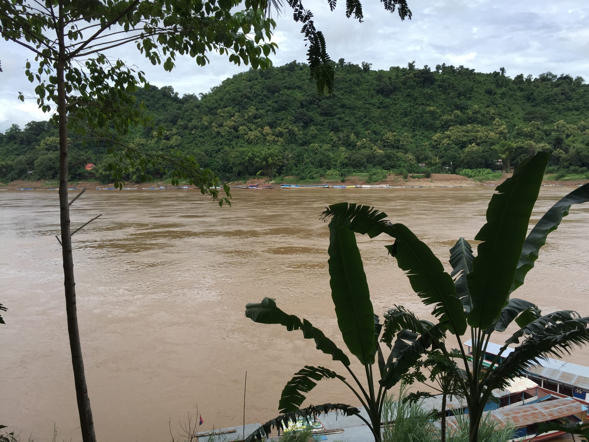 Photo by Author — the Mekong River from the Saffron Café, Luang Prabang (ຫລວງພະບາງ/ຫຼວງພະບາງ), Laos