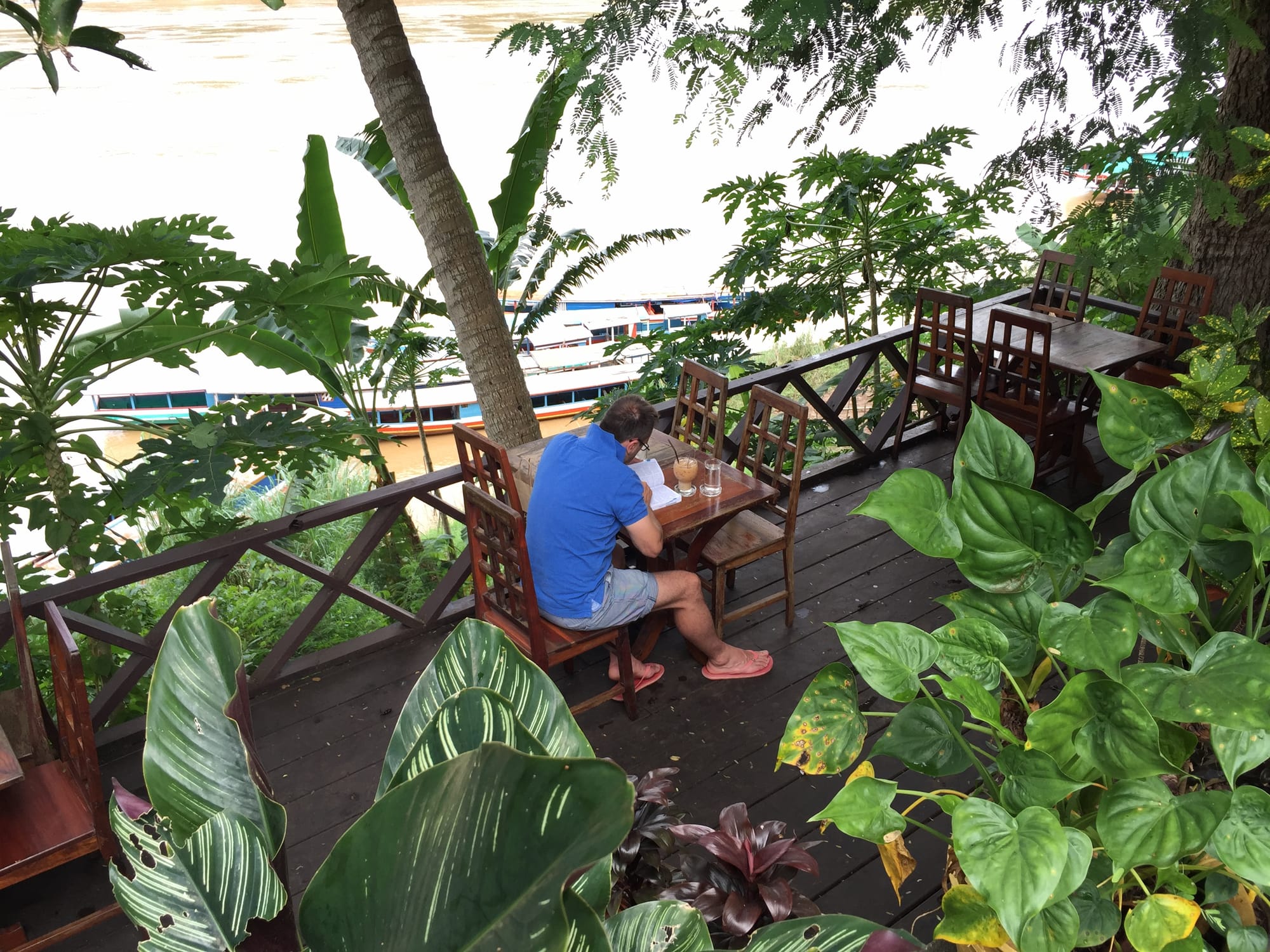 Photo by Author — overlooking the Mekong River from the Saffron Café, Luang Prabang (ຫລວງພະບາງ/ຫຼວງພະບາງ), Laos