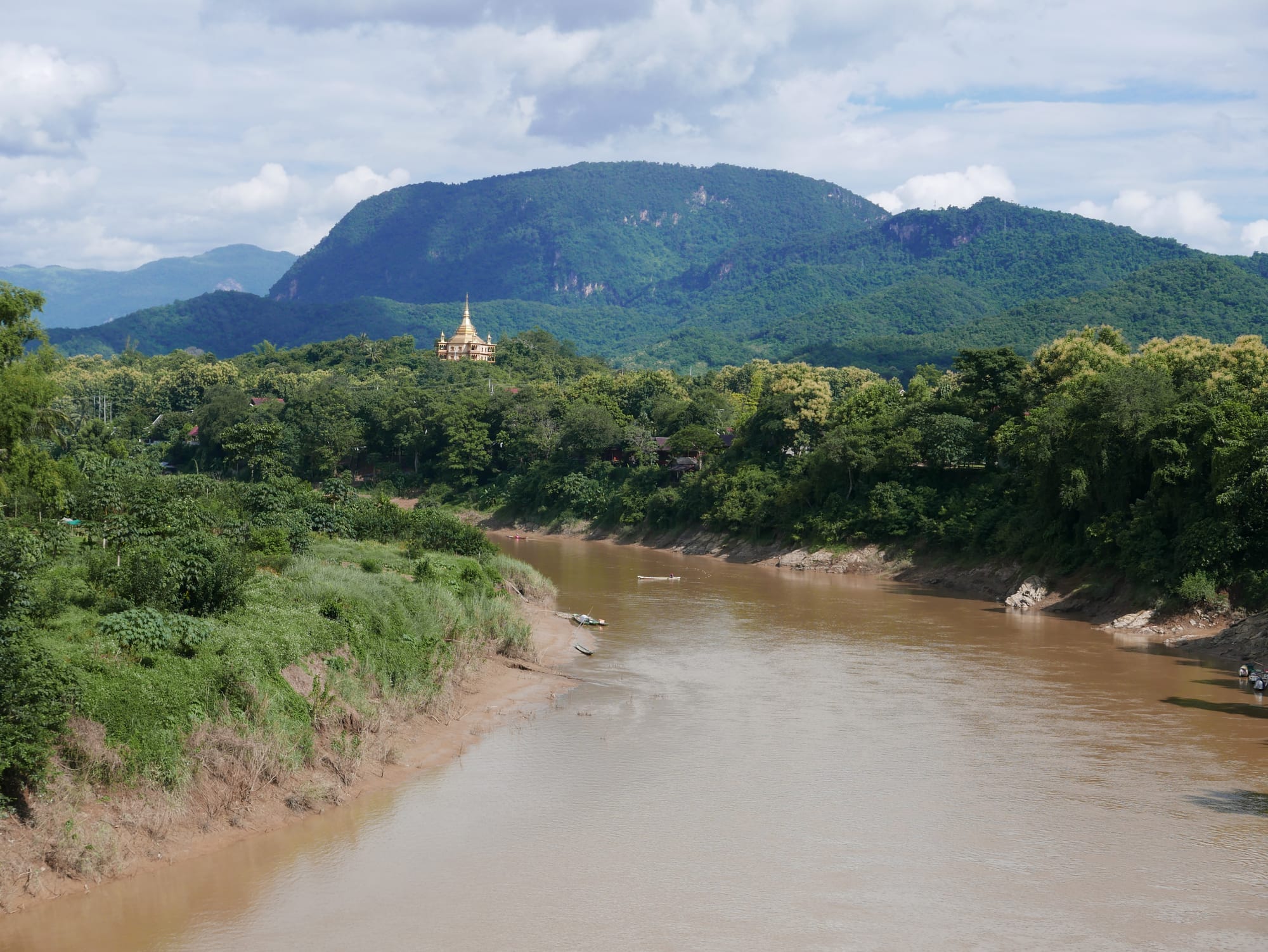 Photo by Author — the view from The Old Bridge, Luang Prabang (ຫລວງພະບາງ/ຫຼວງພະບາງ), Laos