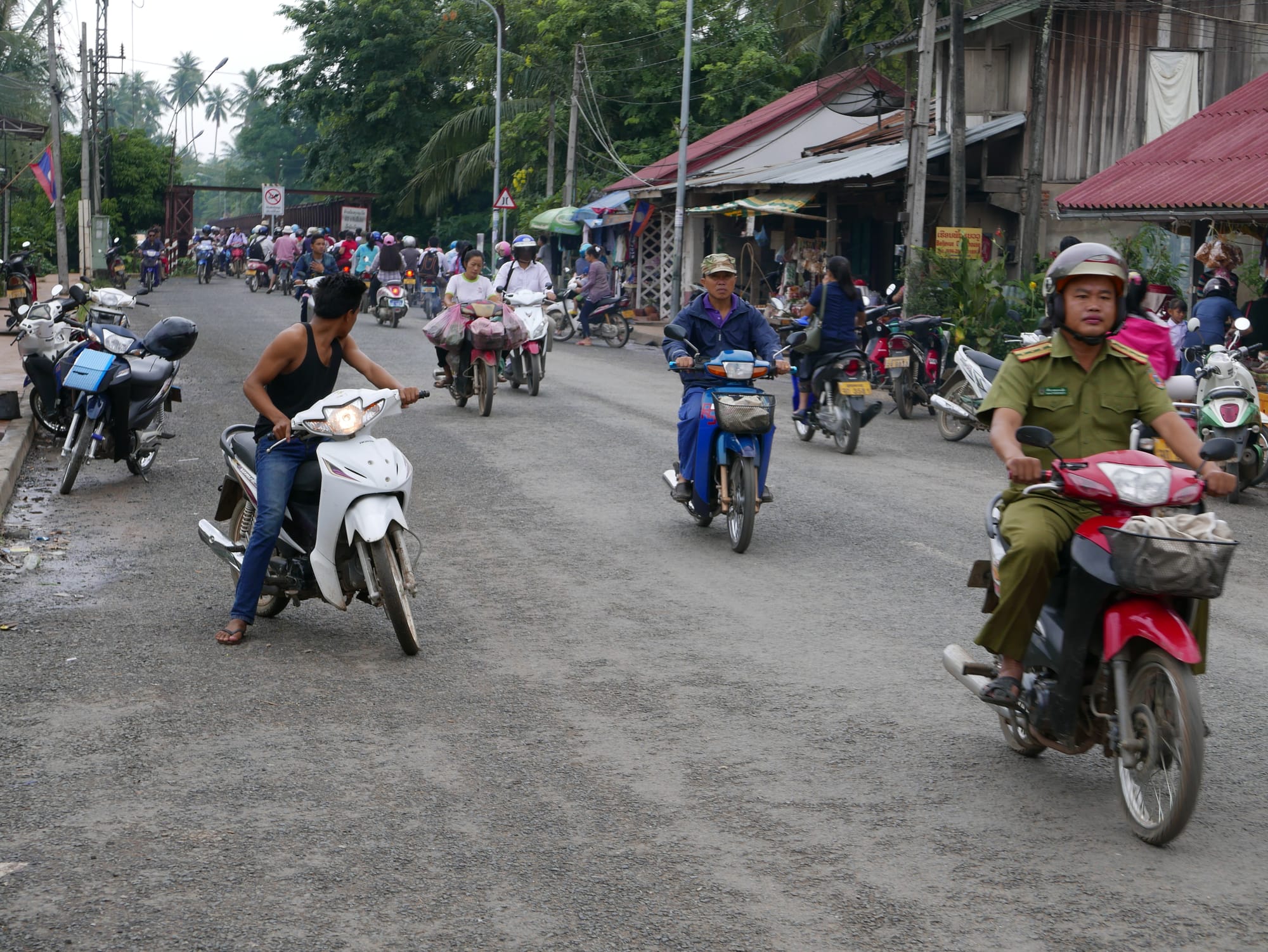 Photo by Author — motorbikes in Luang Prabang (ຫລວງພະບາງ/ຫຼວງພະບາງ), Laos — rush hour