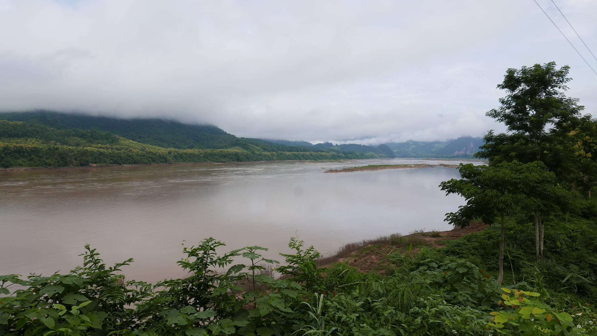 Photo by Author — the view across the Mekong River — Tham Ting (Tam Ting)/Pak Ou (ถ้ำติ่ง) Caves, Laos