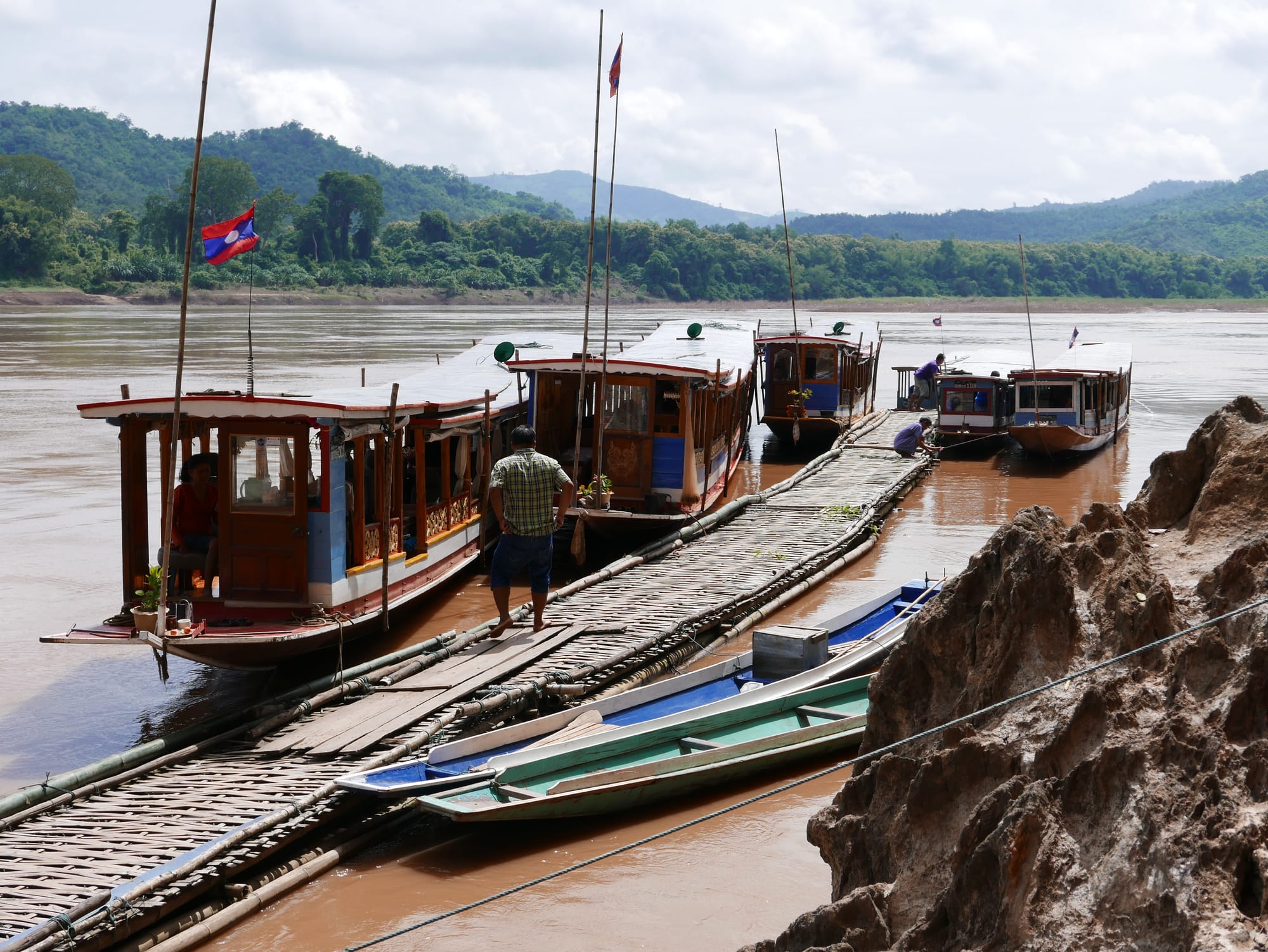 Photo by Author — boats waiting to take visitors back across the Mekong River to Ban Pak Ou — Tham Ting (Tam Ting)/Pak Ou (ถ้ำติ่ง) Caves, Laos