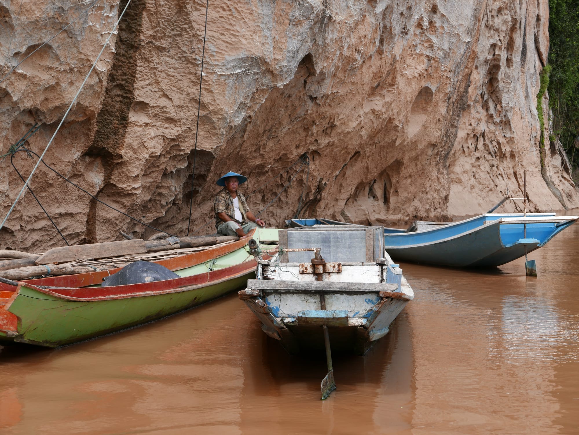 Photo by Author — boats waiting to take visitors back across the Mekong River to Ban Pak Ou — Tham Ting (Tam Ting)/Pak Ou (ถ้ำติ่ง) Caves, Laos