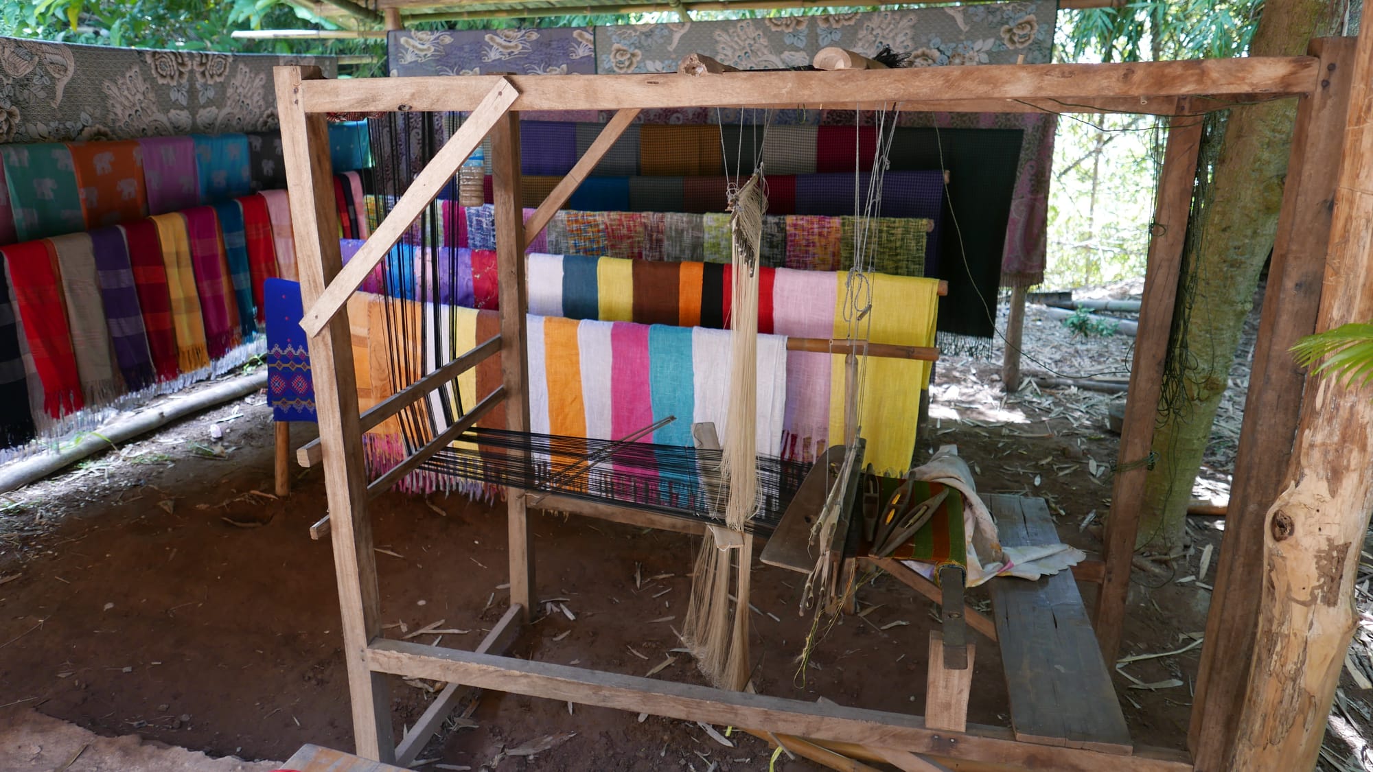 Photo by Author — loom and dyed silk — Ban Xanghai (ບ້ານຊຽງຮາຍ): Liquor & Silk Village, Luang Prabang (ຫລວງພະບາງ/ຫຼວງພະບາງ), Laos