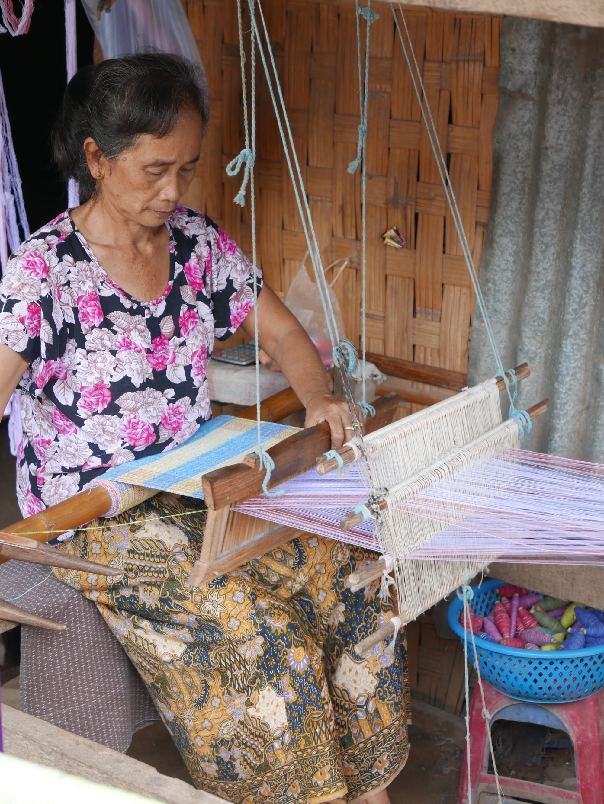 Photo by Author — a weaver at work — Ban Xanghai (ບ້ານຊຽງຮາຍ): Liquor & Silk Village, Luang Prabang (ຫລວງພະບາງ/ຫຼວງພະບາງ), Laos