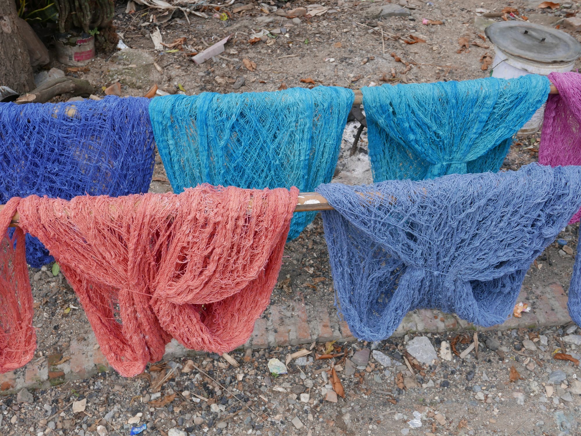 Photo by Author — dyed silk being dried — Ban Xanghai (ບ້ານຊຽງຮາຍ): Liquor & Silk Village, Luang Prabang (ຫລວງພະບາງ/ຫຼວງພະບາງ), Laos