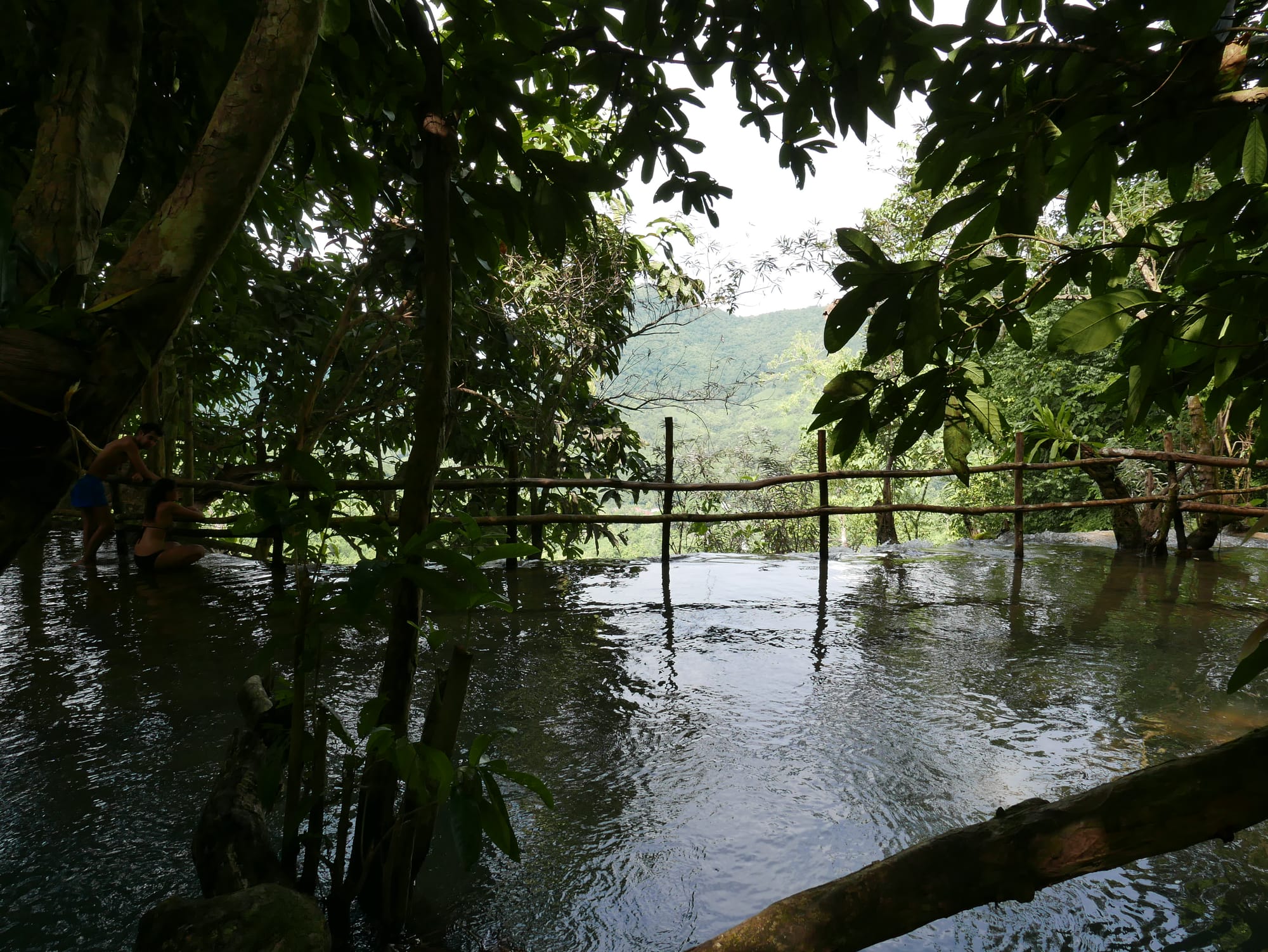 Photo by Author — safety barriers — Kuang Si Waterfall (ນ້ຳຕົກຕາດ ກວາງຊີ), Laos — the upper pools