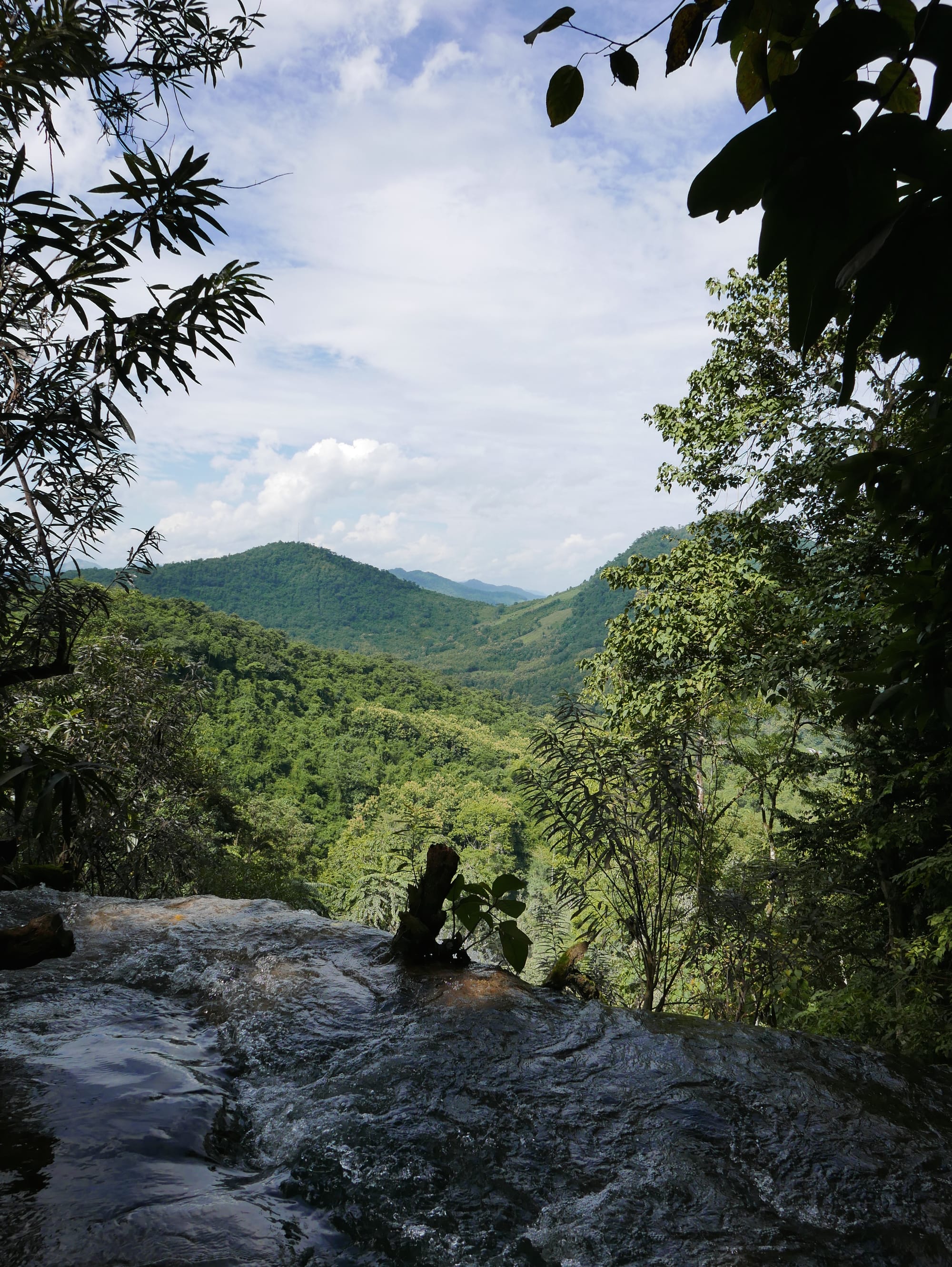 Photo by Author — the view from the upper pools at Kuang Si Waterfall (ນ້ຳຕົກຕາດ ກວາງຊີ), Laos