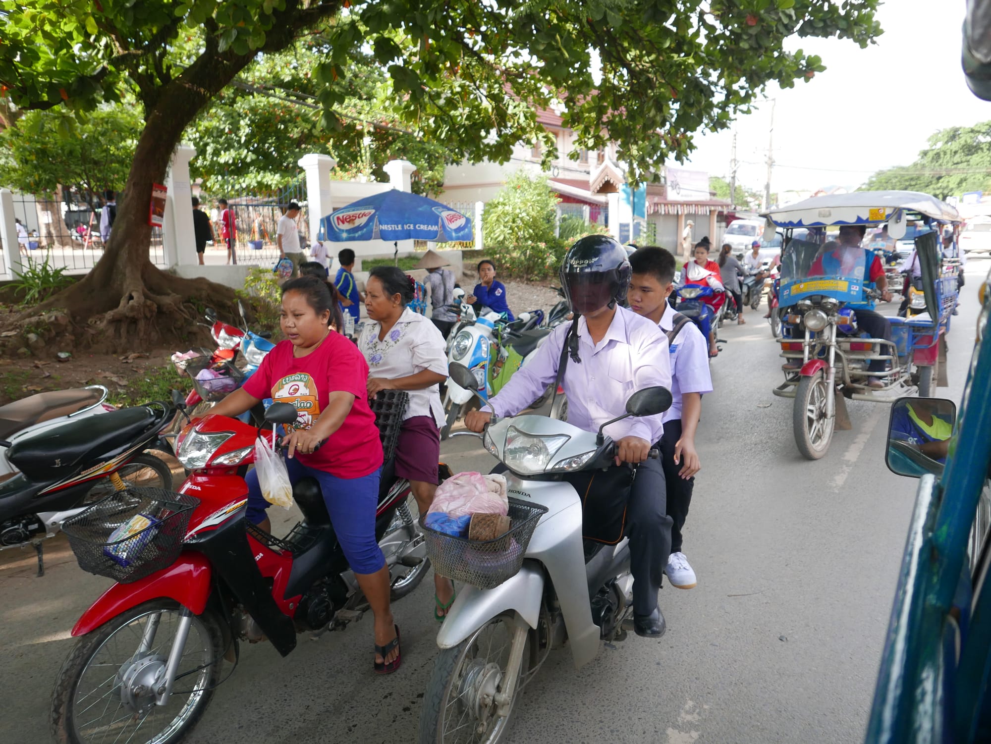 Photo by Author — motorbikes in Luang Prabang (ຫລວງພະບາງ/ຫຼວງພະບາງ), Laos — rush hour