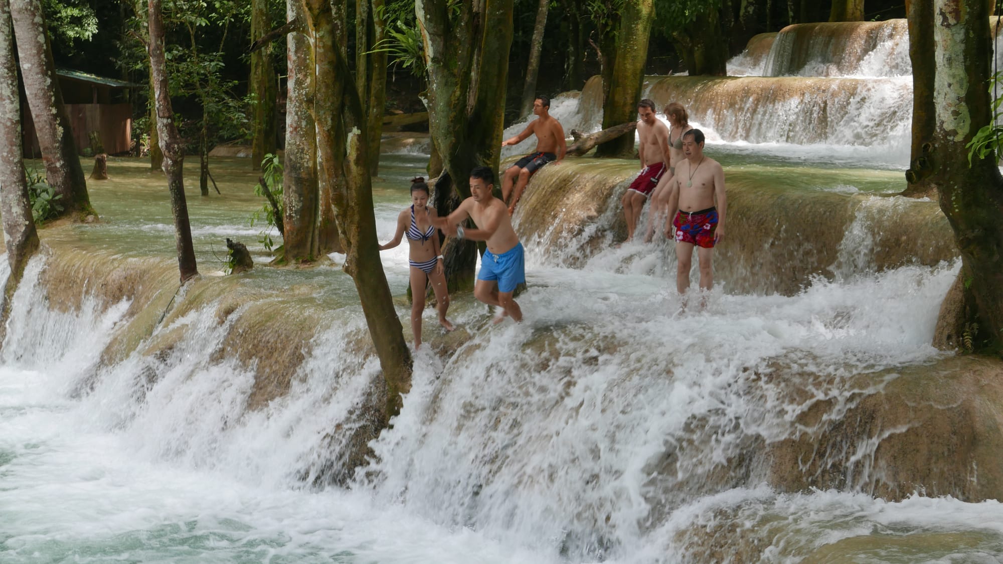 Photo by Author — a photo burst of jumping the falls — Tad Sae Waterfalls (ຕາດແສ້), Luang Prabang (ຫລວງພະບາງ/ຫຼວງພະບາງ), Laos