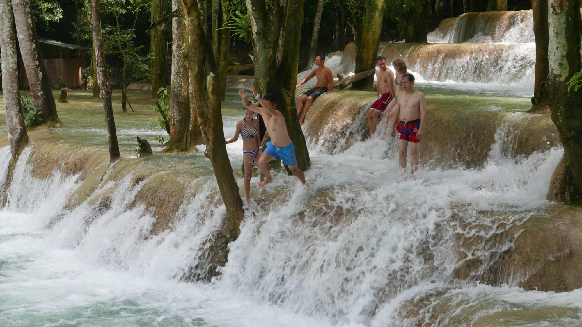 Photo by Author — a photo burst of jumping the falls — Tad Sae Waterfalls (ຕາດແສ້), Luang Prabang (ຫລວງພະບາງ/ຫຼວງພະບາງ), Laos