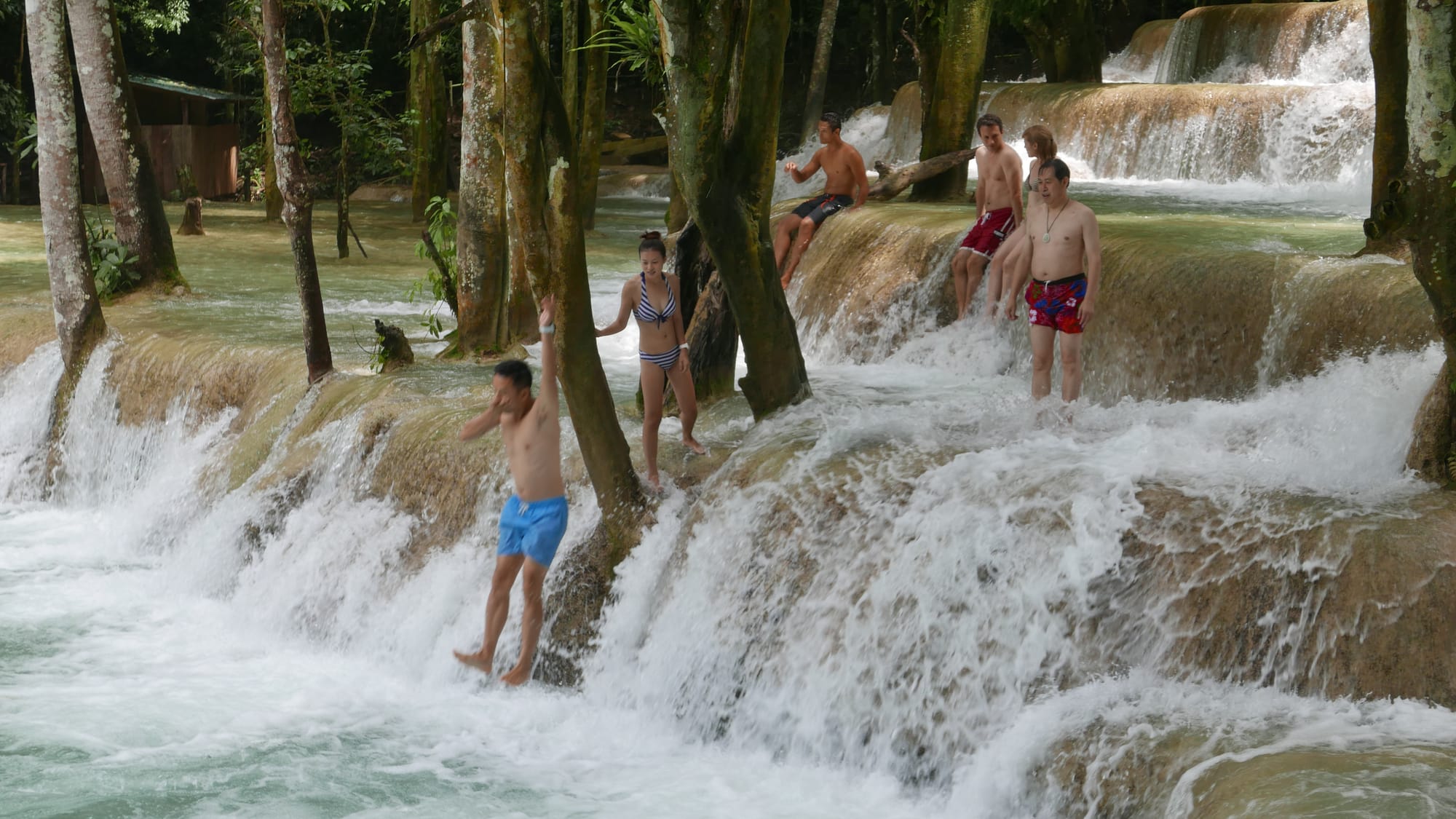 Photo by Author — a photo burst of jumping the falls — Tad Sae Waterfalls (ຕາດແສ້), Luang Prabang (ຫລວງພະບາງ/ຫຼວງພະບາງ), Laos