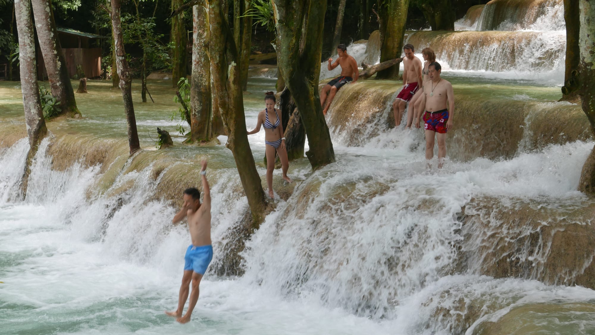 Photo by Author — a photo burst of jumping the falls — Tad Sae Waterfalls (ຕາດແສ້), Luang Prabang (ຫລວງພະບາງ/ຫຼວງພະບາງ), Laos