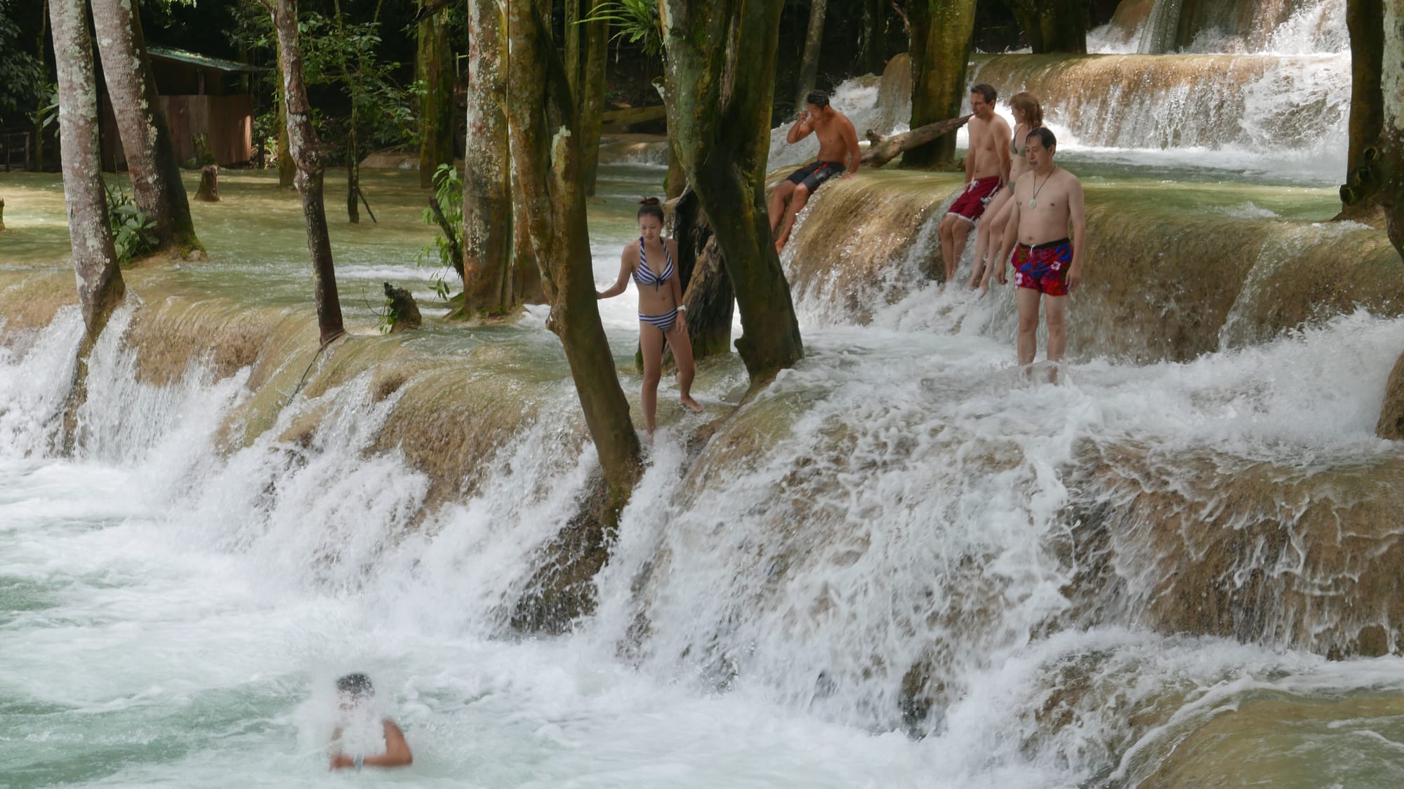 Photo by Author — a photo burst of jumping the falls — Tad Sae Waterfalls (ຕາດແສ້), Luang Prabang (ຫລວງພະບາງ/ຫຼວງພະບາງ), Laos