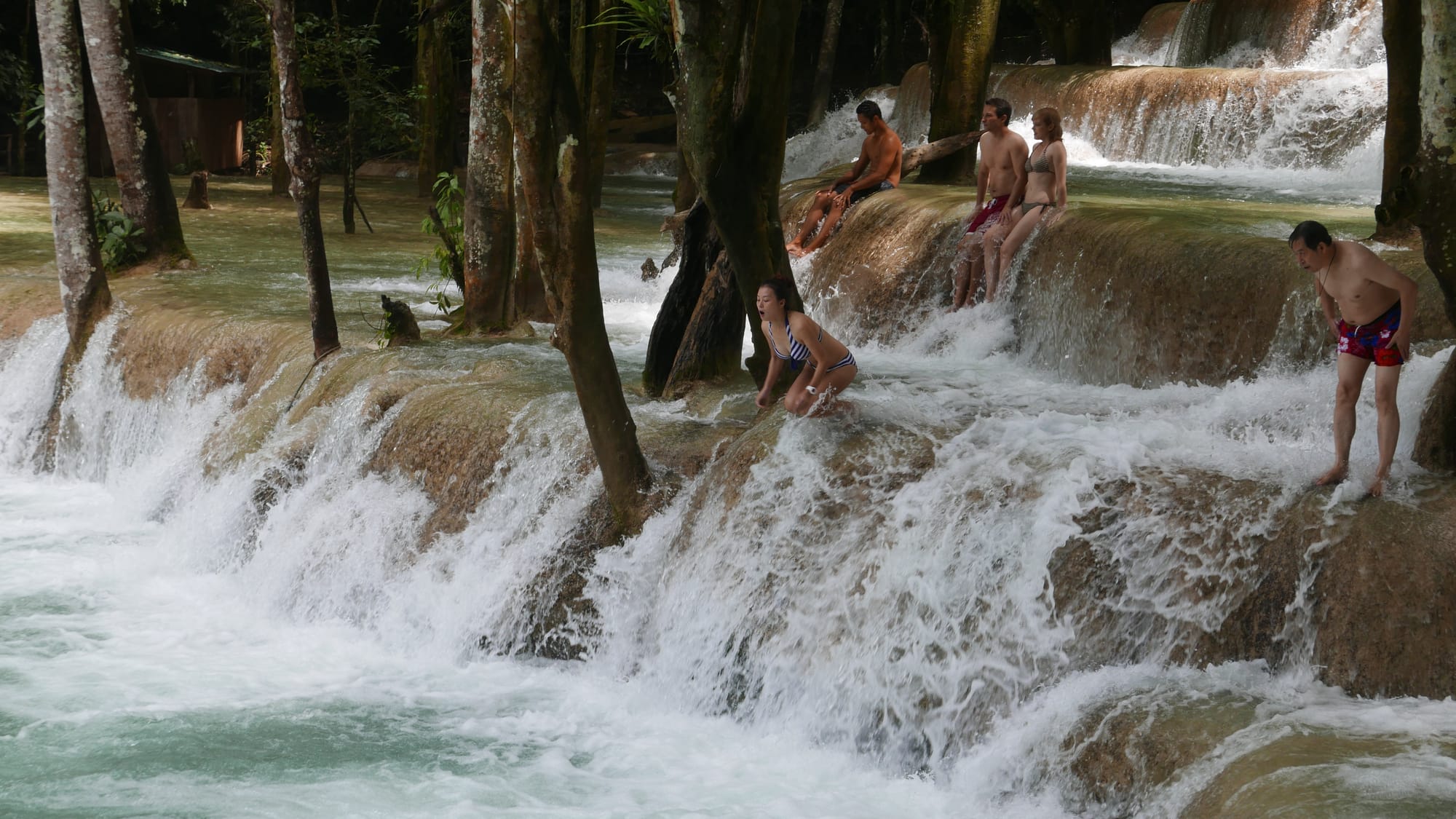 Photo by Author — a photo burst of jumping the falls — Tad Sae Waterfalls (ຕາດແສ້), Luang Prabang (ຫລວງພະບາງ/ຫຼວງພະບາງ), Laos