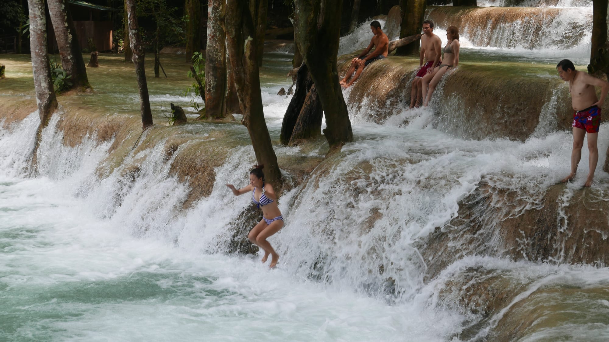 Photo by Author — a photo burst of jumping the falls — Tad Sae Waterfalls (ຕາດແສ້), Luang Prabang (ຫລວງພະບາງ/ຫຼວງພະບາງ), Laos