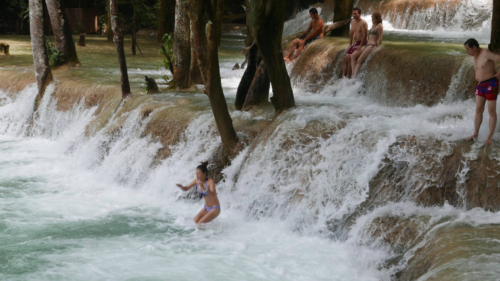 Photo by Author — a photo burst of jumping the falls — Tad Sae Waterfalls (ຕາດແສ້), Luang Prabang (ຫລວງພະບາງ/ຫຼວງພະບາງ), Laos