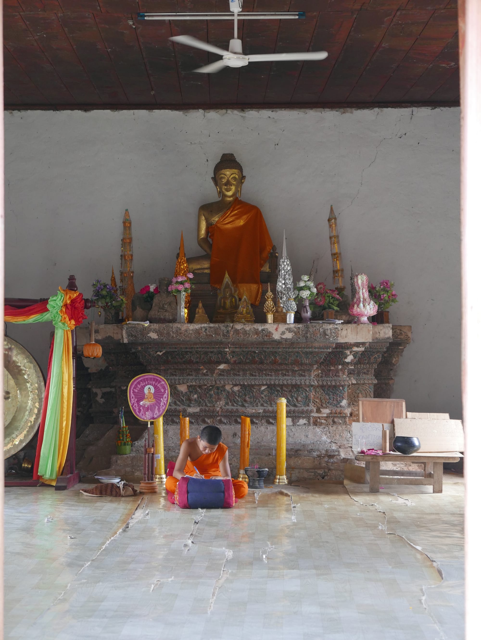 Photo by Author — a monk working inside Chomphet Temple (Wat Chomphet)