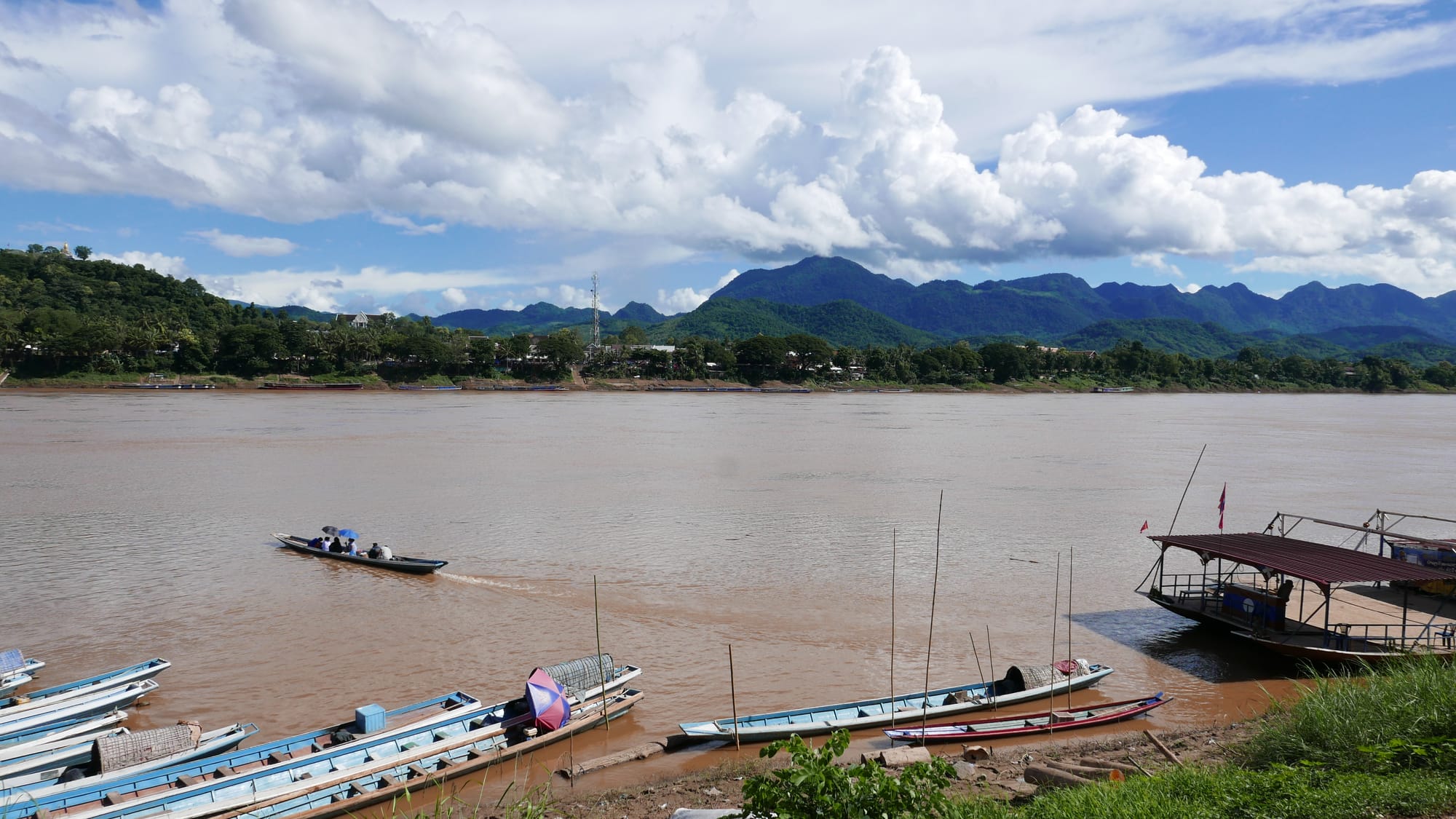 Photo by Author — the view across the Mekong from Luang Prabang (ຫລວງພະບາງ/ຫຼວງພະບາງ), Laos to Ban Xieng Man