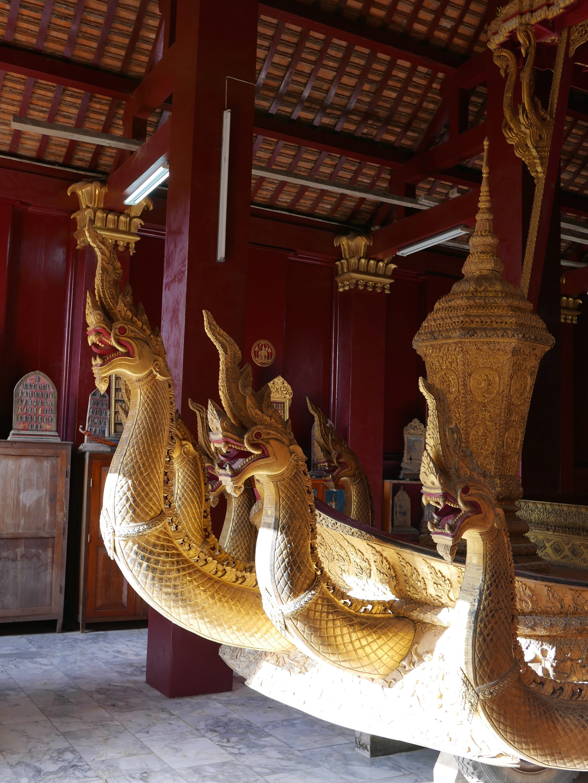 Photo by Author — Naga on the ceremonial barge — Funeral Chapel (also called Chariot Hall) — Wat Xieng Thong (ວັດຊຽງທອງ), Luang Prabang (ຫລວງພະບາງ/ຫຼວງພະບາງ), Laos